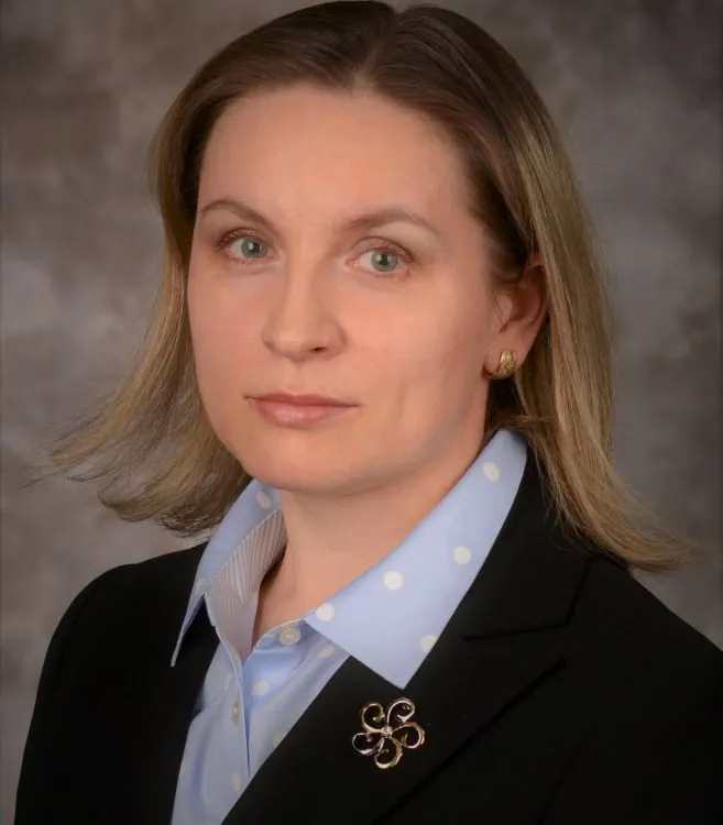 Marina Bykova, attorney at Ishimbayev Law Firm, in a dark blazer